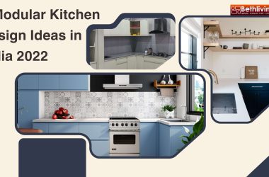 7 Modular Kitchen Design Ideas in India 2022 Bethliving A modern kitchen with glass cabinet doors and mirrored wall panels, enhancing light reflection and the appearance of a larger space.