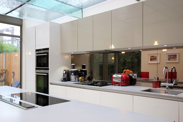Modular kitchen with glass surfaces.