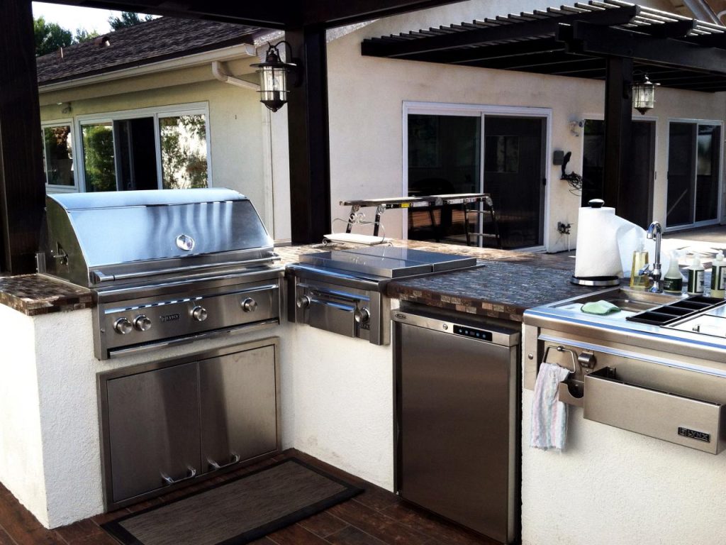 A stainless steel kitchen setup in an outdoor environment, emphasizing its durability and suitability for outdoor use.
